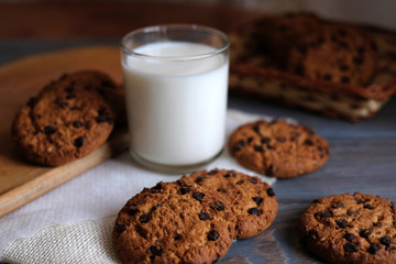 Chocolate cookies on wooden table. Chocolate chip cookies.