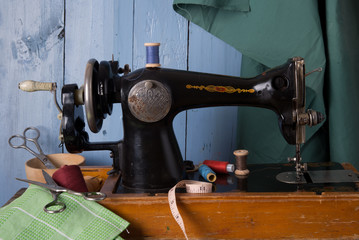 Old sewing machine, fabric and sewing thread.
