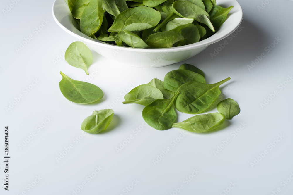 Wall mural spinach on a white background