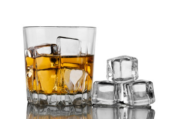 Glass of whiskey with ice and decanter on white background