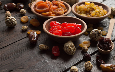 Dried fruits on wooden background