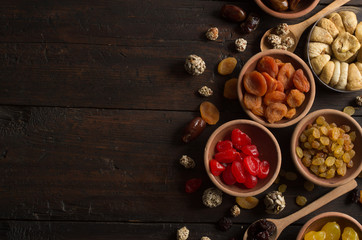 Fototapeta na wymiar Dried fruits on wooden background