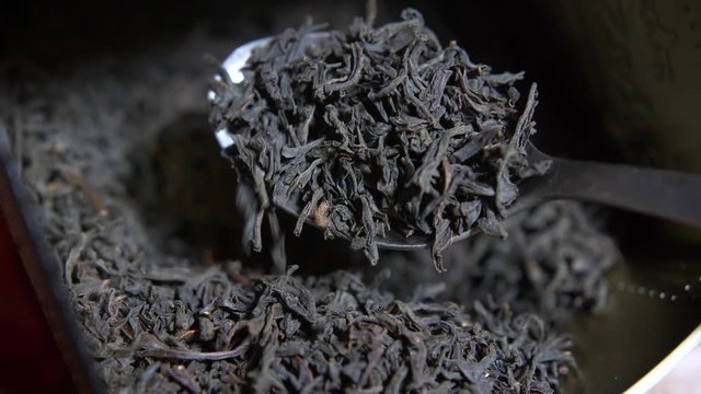 Black large-leafed tea I outweigh with a spoon.