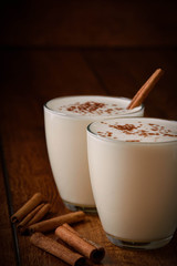 Eggnog houmemade with cinnamon and kakao for Christmas and winter holidays or wooden broun...