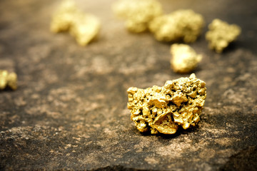 The pure gold ore found in the mine on a stone floor