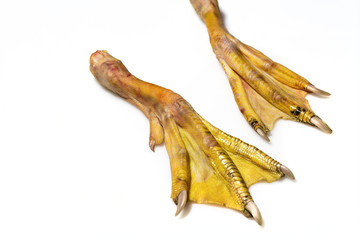 raw duck feet on white background