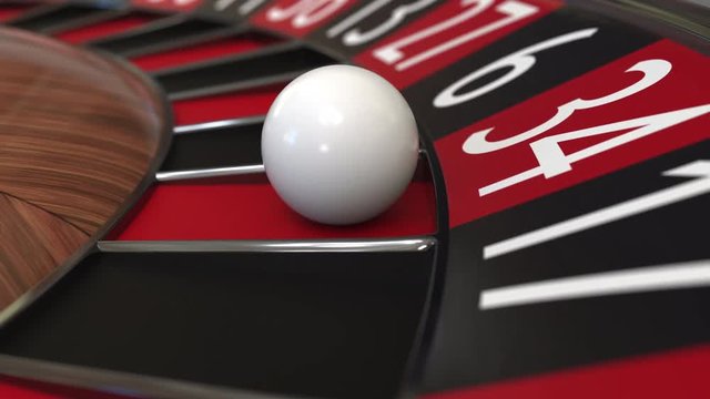 Casino roulette wheel ball hits 34 thirty-four red