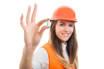  Happy beautiful girl with pill or vitamin