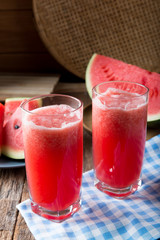Watermelon smoothie on wood background