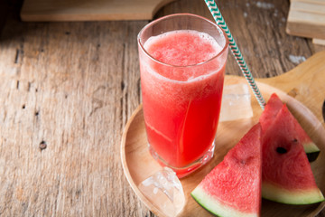 Watermelon smoothie on wood background