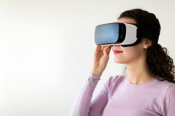 Beautiful woman virtual trying reality glasses at home