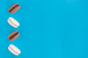 Macaroons in flight on a blue background