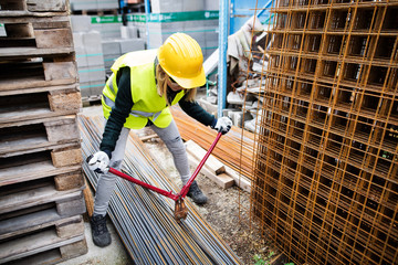 Young woman worker with large bolt cutters.