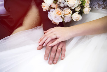 Bride and groom holding hands.