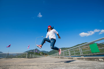 happy woman jump with blue sky.