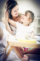 Smiling mother and daughter.