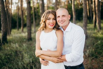 Amazing young couple in the forest