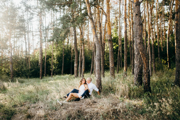 Amazing young couple in the forest