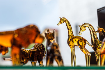 Animal figures made of glass displayed on a shelf of a gift store in Eskisehir