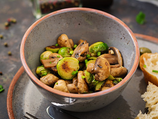 Vegan dish. Baked mushrooms with Brussels sprouts and herbs. Proper nutrition. Healthy lifestyle