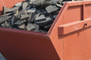 Waste asphalt pavement and concrete materials in container