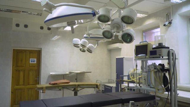 Operating room with equipment and medical devices in a veterinary clinic. Table for surgical operations in the hospital. Interior of operating room in modern clinic.