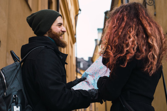 Couple with map on street