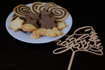 Christmas gingerbread cookies on a white plate.