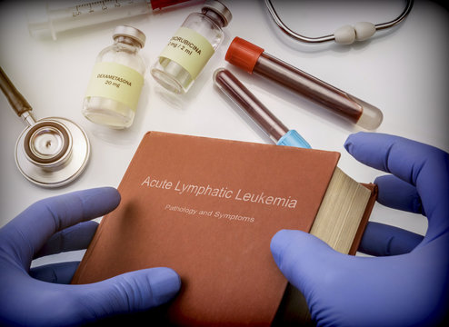 Doctor holds in its hands a book on the Acute lymphatic leukemia, conceptual image