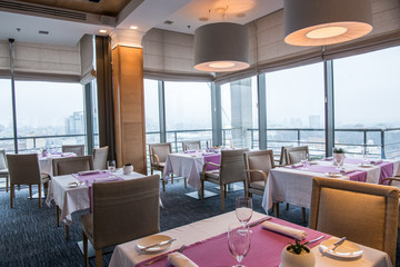 served tables for visitors in cozy restaurant