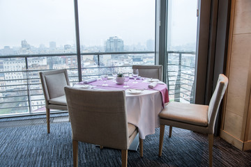 close up view of served table and chairs in restaurant