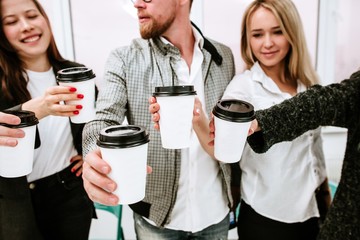 Creative business team in a break drinking coffee