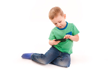 Curious little boy using tablet pc