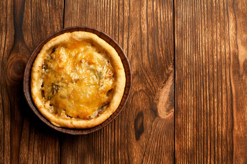 Mini Pizzas - Fresh homemade mini pizzas on rustic wooden background with copy space.