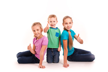 Group of happy kids with thumbs up