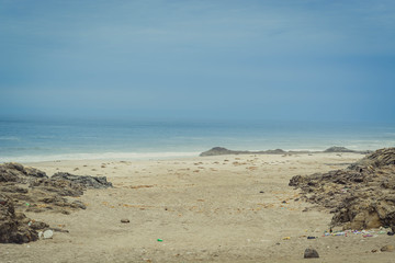 Beach pollution on the ocean coast.