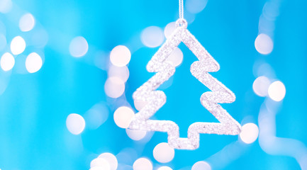 Christmas card with Christmas decorations on a sparkling blue background