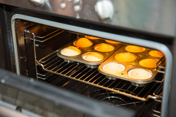 muffins on a baking tray in the oven