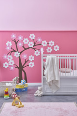 Fototapeta na wymiar modern baby room pink wall design with room objects bed and toys