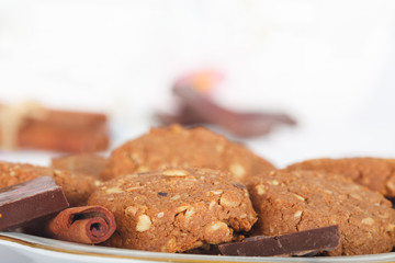 Chocolate cookies on the plate. Sweet food.