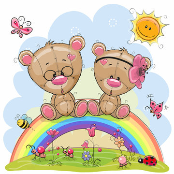 Two Teddy Bears are sitting on the rainbow
