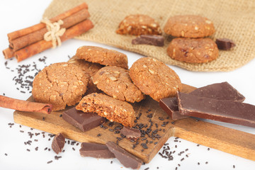 Soft dark chocolate brownie cookies on wooden board