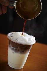 Pouring coffee in cup