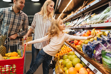 Family with shopping cart in supermarket