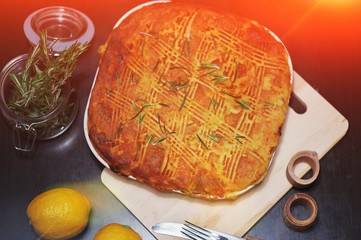 Traditional pie for a family holiday. Beautiful meat, fish or vegetable pie with a golden crust.