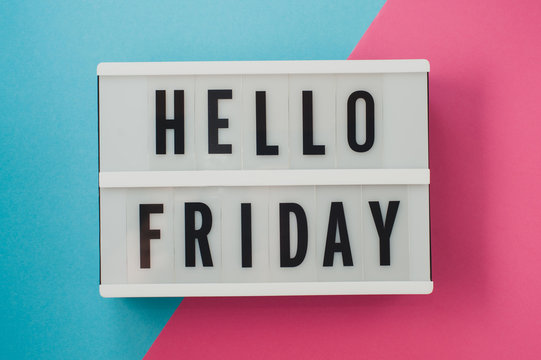 Hello Friday- text on a display on blue and pink bright background.