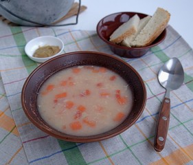 Delicious fish soup with millet, potatoes and carrots