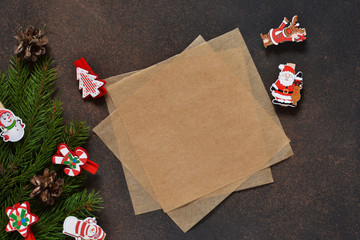 New Year card. Letter for Santa. Christmas tree and decorative clothespins on a brown background with space under the text.