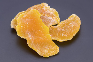 Dehydrated(dried) ripe Mango on black plate