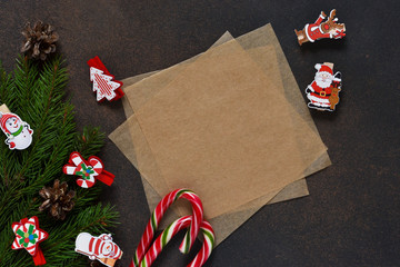 New Year card. Letter for Santa. Christmas tree and decorative clothespins on a brown background with space under the text.